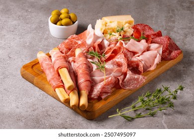 Charcuterie board. Antipasti appetizers of meat platter with salami, prosciutto crudo or jamon and olives. - Powered by Shutterstock