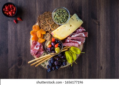 Charcuterie board arrangement of Italian meats, cheese and finger foods. - Powered by Shutterstock