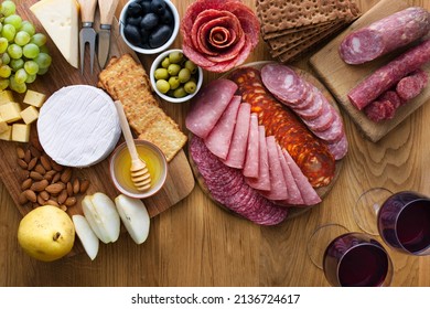 Charcuterie Board And A Cheese Board On A Wooden Table. Flatlay. The Concept Of A Festive Table