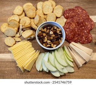 Charcuterie board with crostini's, cured meat, artisanal cheese, fruit, and nuts - Powered by Shutterstock