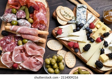 Charcuterie board italian food antipasti prosciutto ham, salami, olives and grissini bread sticks. different  Italian cheese on a board parmesan, pecorino, gorgonzola - Powered by Shutterstock