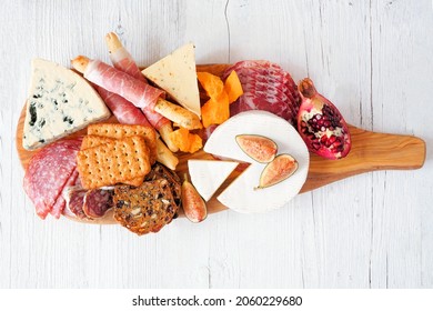 Charcuterie Board Of Meat, Cheese And Appetizers. Top Down View Over A White Wood Background.