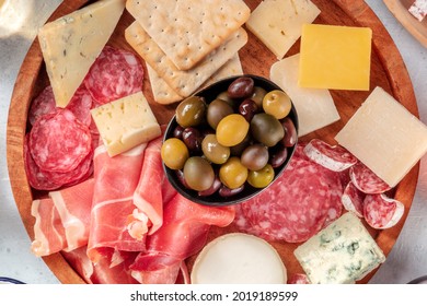 Charcuterie And Cheese Board Close-up. Italian Antipasti Platter With Blue Cheese, Prosciutto Di Parma Ham, Salami, Overhead Shot. Cold Meats Buffet