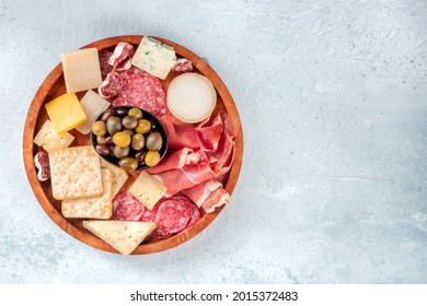 Charcuterie And Cheese Plate, Overhead Shot With A Place For Text. Parma Ham, Blue Cheese, Olives. Gourmet Appetizers At A Banquet