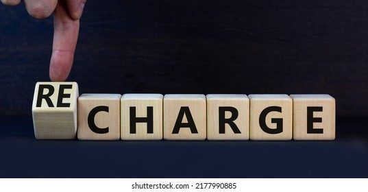 Charge Or Recharge Symbol. Turned Wooden Cubes And Changed The Word Charge To Recharge. Beautiful Grey Table Grey Background. Business Charge Or Recharge Concept. Copy Space.