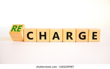 Charge Or Recharge Symbol. Turned Wooden Cubes And Changed The Word Charge To Recharge. Beautiful White Table White Background. Business Charge Or Recharge Concept. Copy Space.