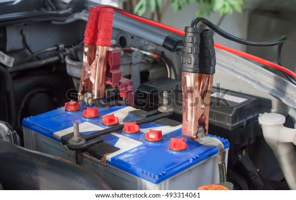 Charging battery car with electricity trough\
jumper cables