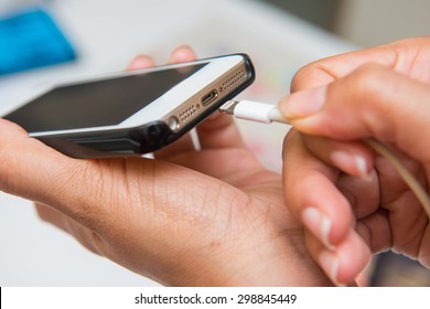 Charging Battery On Mobile Phone, Hand