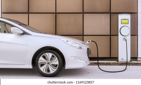 Charging electric car on a city parking lot the future of mobility - Shutterstock ID 1169123857