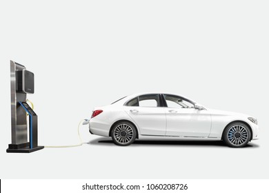 Charging An Electric Car With Station For Clean Energy Future Of Transportation Ecology Concept Isolated On White Background With Clipping Path