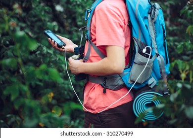 Charging mobile phone during the journey - Shutterstock ID 310270499