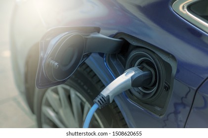 Charging an modern electric car charged for hybrid as the future of the Automobile. power supply plugged into an electric car - Shutterstock ID 1508620655
