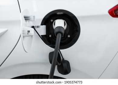 Charging Modern Electric Car From Station, Closeup