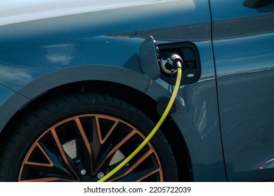 Charging Modern Electric Car From Station, Closeup