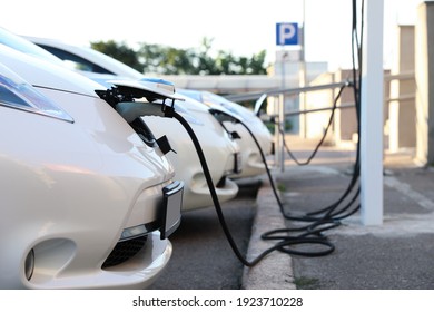 Charging modern electric cars from station outdoors