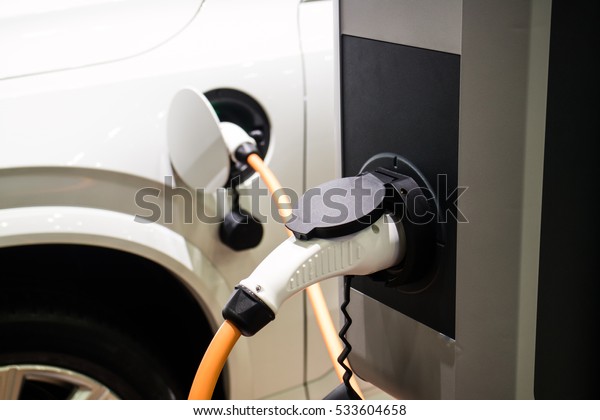Charging\
Power To vehicles. Electric car. Plug in\
hybrid