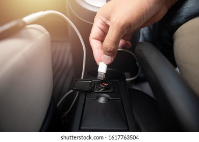 Charging Smartphone Battery With Usb Charger In The Car.