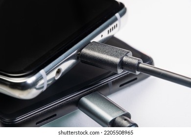 Charging smartphone. Close-up image. White background. - Shutterstock ID 2205508965
