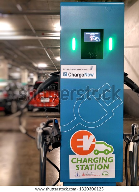 Charging\
station for electric car in the indoor car parking of shopping\
center at Chiang Mai,Thailand.Feb 22,2019.\
