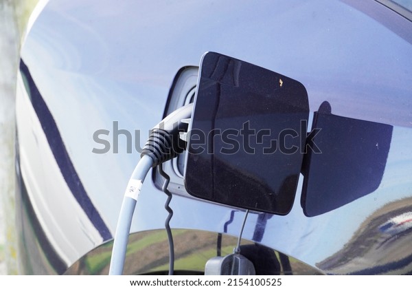 Charging station for electric cars.\
Charging the electric vehicle at a charging\
station.	
