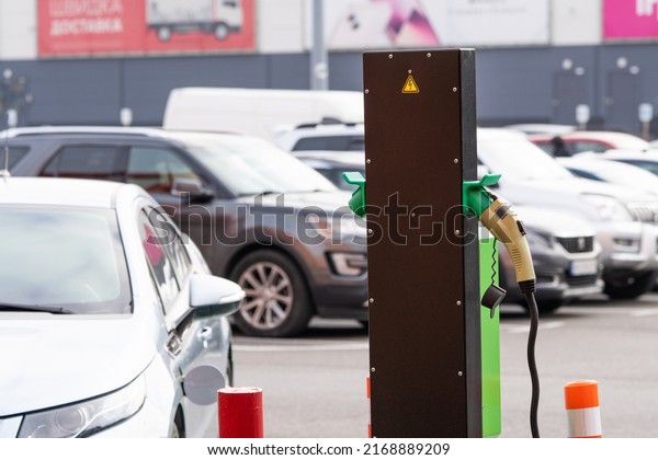Charging\
station for electric vehicles to charge the battery of an electric\
vehicle. Charging point in the parking\
lot.