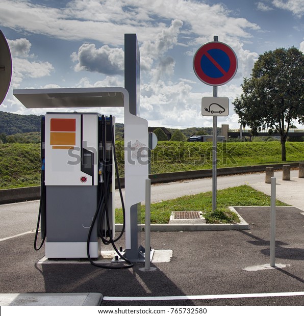 Charging station for electric vehicles, electro\
car charging station on gas station. New technologies in everyday\
life,  environmentally friendly and ecologically pure ways of using\
energy