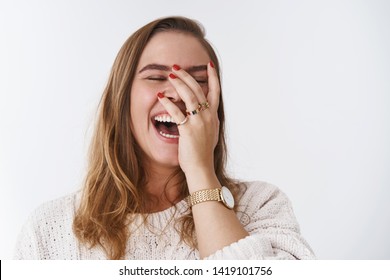 Charismatic carefree joyful friendly-looking outgoing woman likes laugh out loud not hiding emotions giggling hear funny hilarious joke chuckling facepalm close eyes smiling broadly white background