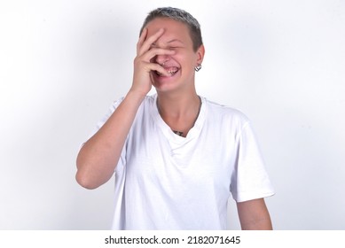 Charismatic Carefree Joyful Young Woman With Short Hair Wearing White T-shirt Over White Background Likes Laugh Out Loud Not Hiding Emotions Giggling Hear Funny Hilarious Joke Chuckling Facepalm.