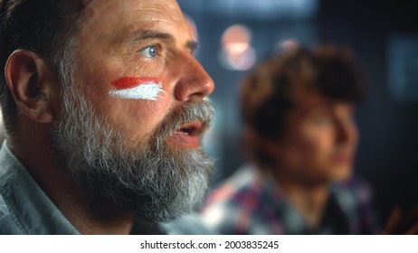 Charismatic Emotional Sports Fan With Painted Face Watching Game, Celebrate Victory When Sports Team Wins Championship. Cheer, Shout For The Favourites Playing On A Tournament. Close-up Portrait Shot