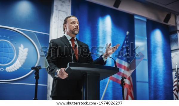 Charismatic Organization Representative\
Speaking at a Press Conference in USA Government Building. Press\
Office Representative Delivering a Speech at a Summit. Minister\
Speaking to\
Congress.
