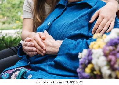 Charities for Elderly People. Young hands holding old elderly senior hands. Support for the seniors concept. - Shutterstock ID 2159345861