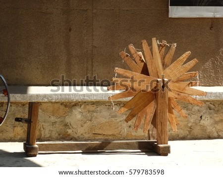 Similar – Image, Stock Photo Vibrant orange yarn spools in industrial setting
