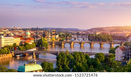 Charles Bridge, Prague, Czech Republic. Charles Bridge (Karluv Most) and Old Town Bridge Tower at sunset. Famous iconic image of Charles bridge. Concept of sightseeing and tourism. Czechia