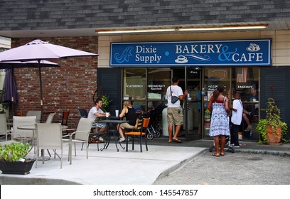 CHARLESTON - JUL 22: Customers Entering And Eating At The Dixie Supply Bakery & Cafe In Charleston, SC. Featured On Diners, Drive-Ins And Dives On The Food Network Channel July 30, 2012.