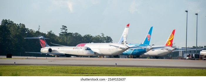 Charleston, SC - June 19 2022: A Boeing 717 Parked In Front Of Three Brand New 787 Dreamliners Made At The Charleston Production Facility 