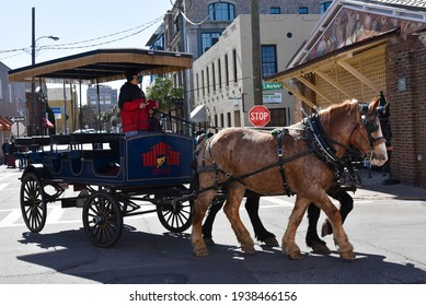 Charleston, SC, USA - February 08 2021: Horse-drawn Carriage Touring The Streets Of Historic Charleston South Carolina.