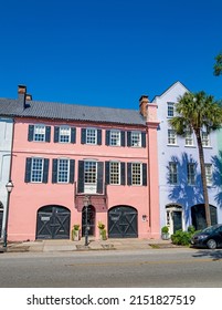 Charleston, South Carolina, USA: April 21st 2022;  Tourists On A Horse And Cart In Front Of The Famous Rainbow Row Houses In Charleston.