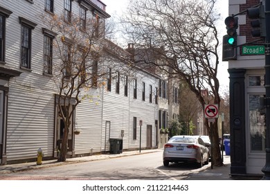 Charleston, South Carolina, USA Dec 28 2021: unknown pastel antebellum houses in Charleston, a port, holy city founded in 1670. It is also famous for its cobblestone streets, horse-drawn carriages.