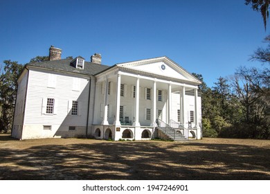 Charleston, South Carolina, USA- February 23, 2021: Exterior of the historic Hampton Plantation. The reportedly haunted antebellum style mansion is the centerpiece of a South Carolina State Park.