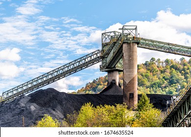Charleston, West Virginia, USA city with coal mound and industrial factory conveyor belt power plant exterior architecture with elevator lift