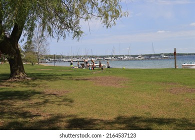 Charlevoix, MI, USA - May 29, 2022:  Early Summer Outdoor Activity Along The Shore Of Lake Charlevoix In Northern Michigan.