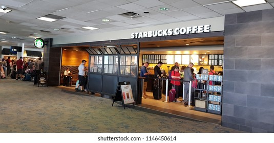 CHARLOTTE INTERNATIONAL AIRPORT, CHARLOTTE. SOUTH CAROLINA, USA. JULY 31 2018.  Busy Starbucks Coffee Shop Inside The Charlottle International Airport 