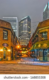 charlotte, nc  - December 8, 2013: Night view of a narrow alley street with restaurants in charlotte, nc