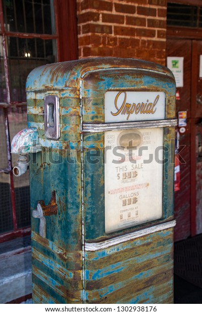 Charlotte, NC -\
February 2, 2019 - Vintage Imperial gas pump (Gilbarco Calco-Meter)\
at old general store