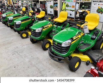 Charlotte, NC - July 6, 2019: John Deere Small Lawn Mower E Series Tractors On Display At A Home Depot.