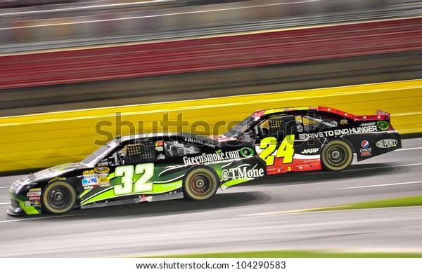 CHARLOTTE, NC - MAY 27:  Jeff Gordon 24 is\
passing TJ Bell 32 at the Nascar Coca Cola 600  at Charlotte\
Motorspeedway in Charlotte, NC on May 27,\
2012