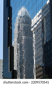 Charlotte, NC - September 24, 2022: The Bank Of America Corporate Center In Charlotte Reflected In A Nearby Building