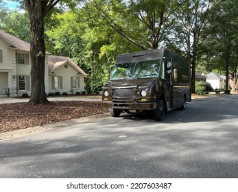 Charlotte, NC - September 28, 2022: Brown UPS United Parcel Service Truck Delivering Packages In A Residential Neighborhood