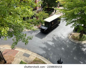 Charlotte, NC - September 29, 2022: Brown UPS United Parcel Service Truck Delivering Packages In A Residential Neighborhood	