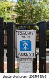 Charlotte, NC  -
September 3, 2021: Community Watch Police 911 Sign At The Entrance To A Gated Community